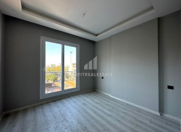 One-bedroom apartment, 55m², in a new urban-type building in Tomuk, Mersin ID-13845 фото-13