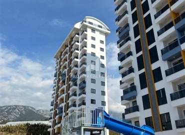 One-bedroom unfurnished apartment, 60 m2, unfurnished, in a new residence with facilities, Mahmutlar, Alanya ID-13895 фото-2