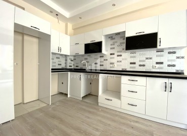 Квартира с одной спальней, 55м², в комфортабельном комплексе на этапе строительства в районе Томюк, Мерсин ID-13904 фото-1