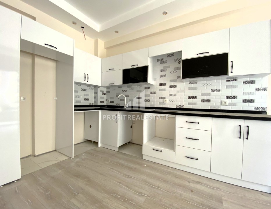 Квартира с одной спальней, 55м², в комфортабельном комплексе на этапе строительства в районе Томюк, Мерсин ID-13904 фото-1