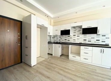 Квартира с одной спальней, 55м², в комфортабельном комплексе на этапе строительства в районе Томюк, Мерсин ID-13904 фото-3