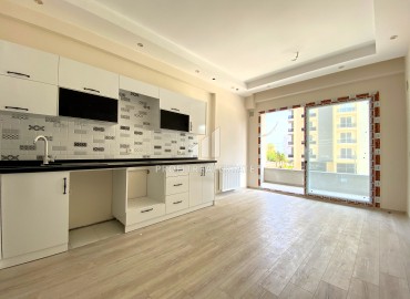 Квартира с одной спальней, 55м², в комфортабельном комплексе на этапе строительства в районе Томюк, Мерсин ID-13904 фото-4