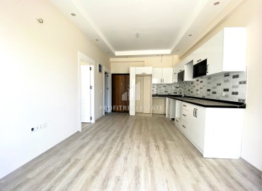 Квартира с одной спальней, 55м², в комфортабельном комплексе на этапе строительства в районе Томюк, Мерсин ID-13904 фото-5