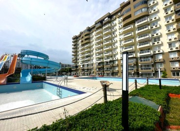View furnished apartment 3 + 1, 145m², in a cozy residence on the first coastline in the area of Mersin - Kargipinari ID-13913 фото-1