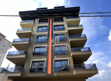 Недорогая трехкомнатная квартира в новостройке, 80м2, без мебели, на финальном этапе строительства в Авсалларе, Аланья ID-13923 фото-1