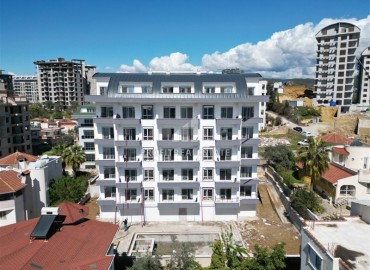 Апартаменты 1+1 и 2+1 пентхаусы, 57-120м², в комплексе с инфраструктурой в Авсалларе в 2000м от моря на этапе ввода в эксплуатацию ID-14000 фото-1
