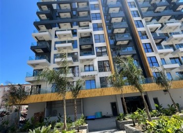 Элитная недвижимость: квартира 2+1, 88м², в строящемся комплексе с отельной инфраструктурой на первой береговой линии в Махмутларе ID-14059 фото-1