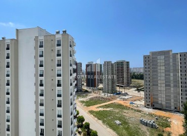 Двухкомнатные апартаменты, 60м², в комплексе премиум класса в 500м от моря в районе Мерсина - Тедже ID-14078 фото-13