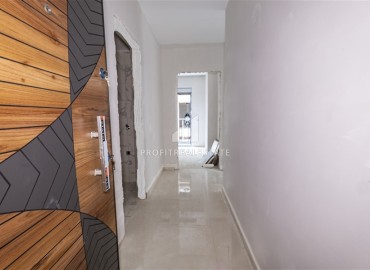 Двухкомнатная квартира без мебели, 55м2, на финальном этапе строительства, в 500 метрах от моря, Махмутлар, Аланья ID-14161 фото-5