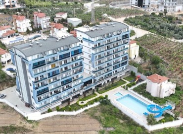Уютная меблированная двухкомнатная квартира 55м2, с видом на море, в комплексе с инфраструктурой, Махмутлар, Аланья ID-14162 фото-1