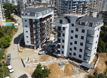 One bedroom apartment, 63m², in a residence under construction, 550m from the sea in Tosmur, Alanya ID-14187 фото-2