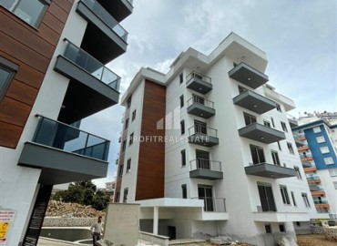 One bedroom apartment, 63m², in a residence under construction, 550m from the sea in Tosmur, Alanya ID-14187 фото-12