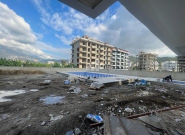 Двухкомнатные апартаменты, 51м², на окончательном этапе строительства, в 150м от моря в районе Каргыджак, Алания ID-14262 фото-16