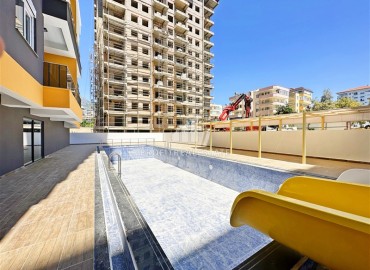 Two bedroom apartment 80m2, unfurnished, in a new residential residence, 200 meters from the sea, Mahmutlar, Alanya ID-14303 фото-20