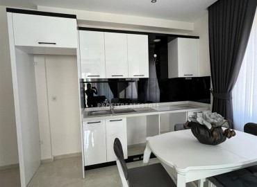 Furnished one-bedroom apartment 54m2, with mountain views, in a residence with facilities, Mahmutlar, Alanya ID-14322 фото-10