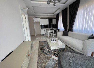 Furnished one-bedroom apartment 54m2, with mountain views, in a residence with facilities, Mahmutlar, Alanya ID-14322 фото-12