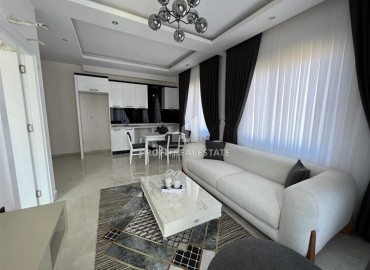 Furnished one-bedroom apartment 54m2, with mountain views, in a residence with facilities, Mahmutlar, Alanya ID-14322 фото-13