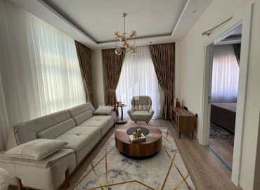 Elegant furnished apartment with a sea view, layout 1 + 1, 49m2, in a residence with facilities, Mahmutlar, Alanya ID-14324 фото-2