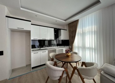 Elegant furnished apartment with a sea view, layout 1 + 1, 49m2, in a residence with facilities, Mahmutlar, Alanya ID-14324 фото-4