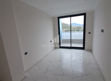 Sea view penthouse, 100m2, with three bedrooms, in a new residential residence with facilities, Mahmutlar, Alanya ID-14340 фото-4