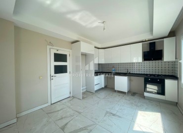Two bedroom apartment, 130m², in an urban-type house with a parking 450m from the sea in Tej, Mersin ID-14397 фото-4