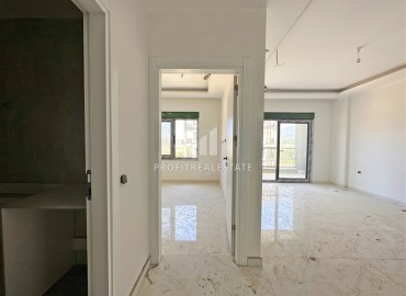 Двухкомнатная квартира 46 м2, с видом на море, без мебели, в новой жилой резиденции в Каргыджаке, Аланья ID-14409 фото-2