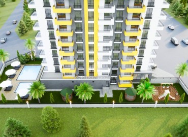 Двухкомнатные квартиры, 65м², в комплексе на этапе строительства в 500м от моря в Эрдемли, Арпачбахшиш ID-14416 фото-8