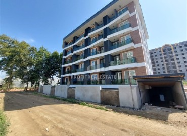 Недорогая двухкомнатная квартира без мебели, 58м2, в новой жилой резиденции с инфраструктурой, Махмутлар, Аланья ID-14424 фото-1