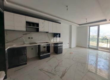 Inexpensive unfurnished one-bedroom apartment, 58m2, in a new residential residence with facilities, Mahmutlar, Alanya ID-14424 фото-2