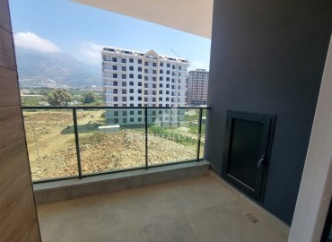 Inexpensive unfurnished one-bedroom apartment, 58m2, in a new residential residence with facilities, Mahmutlar, Alanya ID-14424 фото-9