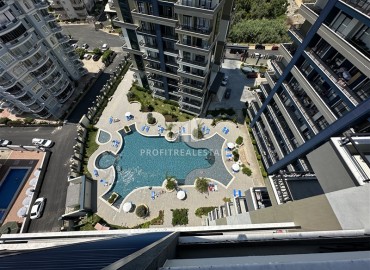 Двухкомнатная квартира, 56м², на высоком этаже элитной новостройки Махмутлара, в 650м от моря, Алания ID-14476 фото-11
