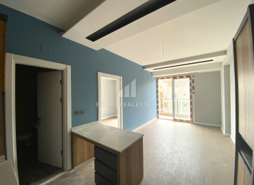 Compact one-bedroom apartment, 50m², in an urban-type house in Ciftlikkoy, Yenishehir district, Mersin ID-14498 фото-6