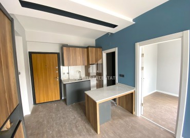 Компактная квартира с одной спальней, 50м², в доме городского типа в Чифтликкёй, район Енишехир, Мерсин ID-14498 фото-9