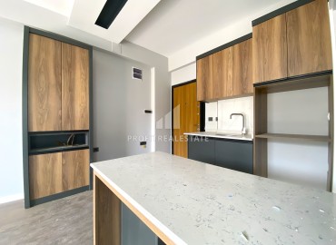 Compact one-bedroom apartment, 50m², in an urban-type house in Ciftlikkoy, Yenishehir district, Mersin ID-14498 фото-10