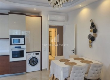 Large furnished one-bedroom apartment 81m2, with a glazed balcony, 400 meters from the sea, Mahmutlar, Alanya ID-14523 фото-5