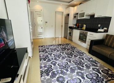 Cozy furnished studio, 40m² in the western part of Mahmutlar, 350m from the coast at an attractive price ID-14557 фото-6