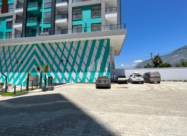 Двухкомнатная квартира, 55м², с великолепным видом в новой элитной новостройке в Махмутларе, Аланья ID-14570 фото-19