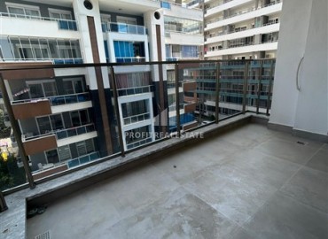 Двухкомнатная квартира без мебели, 55м2, в новой жилой резиденции с инфраструктурой в 200 метрах от моря, Махмутлар, Аланья ID-14583 фото-11