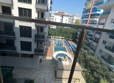 One-bedroom unfurnished apartment, 55m2, in a new residential residence with facilities, 200 meters from the sea, Mahmutlar, Alanya ID-14583 фото-12