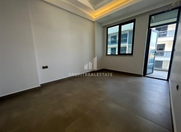 Spacious unfurnished one-bedroom apartment, 60m2, with a sea view, in a new building with facilities, Mahmutlar, Alanya ID-14584 фото-2