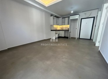 Spacious unfurnished one-bedroom apartment, 60m2, with a sea view, in a new building with facilities, Mahmutlar, Alanya ID-14584 фото-3