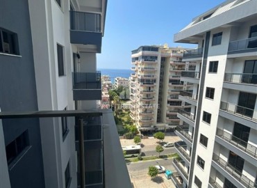 Spacious unfurnished one-bedroom apartment, 60m2, with a sea view, in a new building with facilities, Mahmutlar, Alanya ID-14584 фото-4