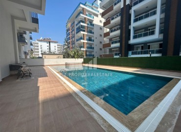 Spacious unfurnished one-bedroom apartment, 60m2, with a sea view, in a new building with facilities, Mahmutlar, Alanya ID-14584 фото-10