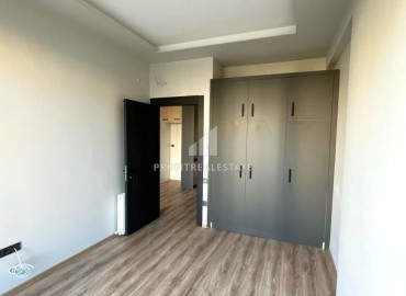 Просторная двухкомнатная квартира, 71м², в новом комплексе в районе Томюк, Мерсин ID-14590 фото-11