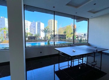 Просторная двухкомнатная квартира, 71м², в новом комплексе в районе Томюк, Мерсин ID-14590 фото-14