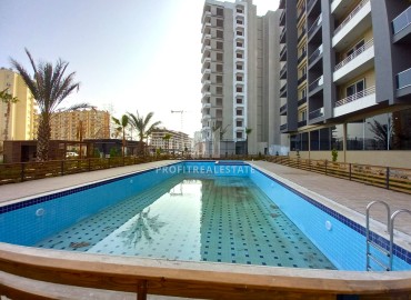 Spacious one-bedroom apartment, 71m², in a new residence in Tomyuk, Mersin ID-14590 фото-15