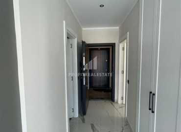 Новая двухкомнатная квартира 55 м2, с чистовой отделкой и кухонным гарнитуром, без мебели, в 150 метрах от моря, Каргыджаке, Аланья ID-14659 фото-12