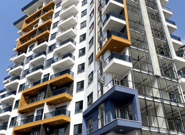 Excellent one-bedroom apartment, 59m², in a residence under construction with hotel facilities 450 meters from the sea in Mahmutlar ID-11544 фото-4