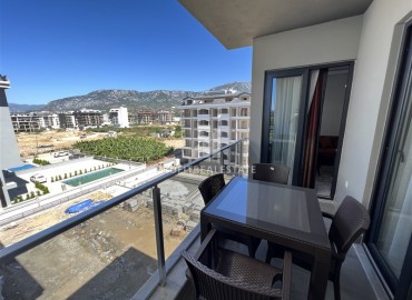 Stylish one-bedroom apartment 50m², with sea views, 100 meters from the beach, Kargicak, Alanya ID-14932 фото-10