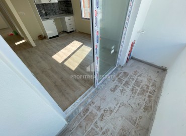 One bedroom apartment, 55m², in a gasified residence under construction in the center of Erdemli ID-15028 фото-11